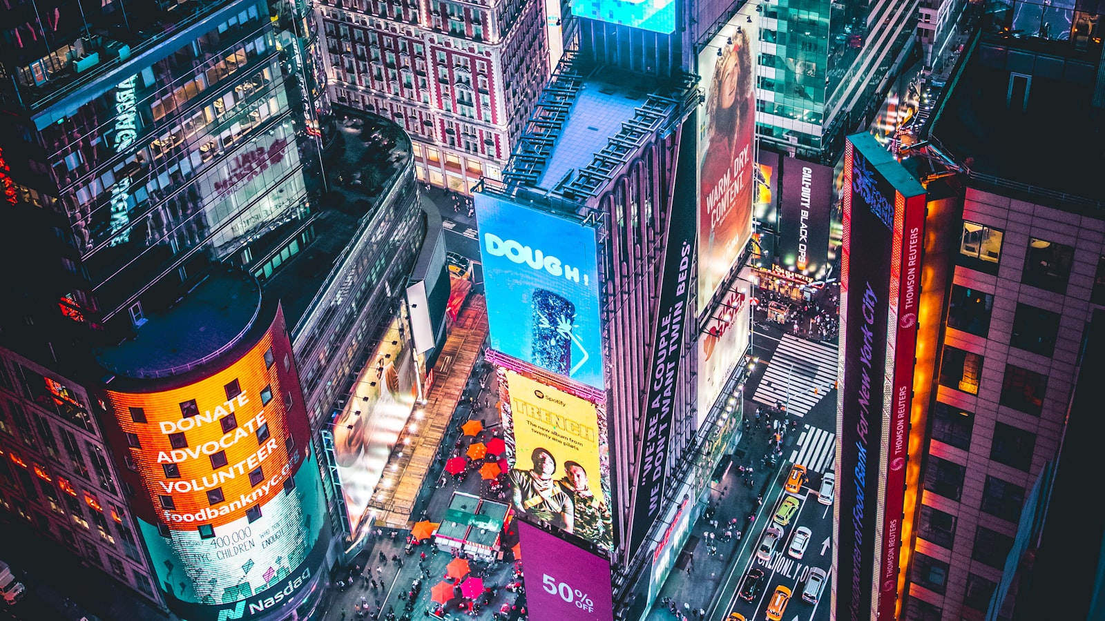 A traveler holding a smartphone showing a map while standing on a city street